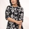 This Ikkat 2PC Set is a perfect fusion of tradition and modern style. Crafted from soft rayon, the A-line kurta features a flattering princess cut that enhances the silhouette. Wooden buttons add a touch of elegance, making it a versatile piece for various occasions. The culottes-style palazzo ensures a breezy, comfortable fit while maintaining a chic appeal. Designed for both casual and semi-formal wear, this set is ideal for work, outings, or festive gatherings. Available in sizes 38 to 44, it offers a stylish and comfortable look for every body type. Pair it with statement earrings and comfortable flats for an effortlessly elegant ensemble. Note: Dry Wash recommended to maintain the fabric and intricate detailing.